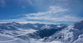 Blue skies over snowy mountains