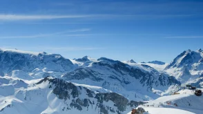Blue sky and white peaks in the Alps