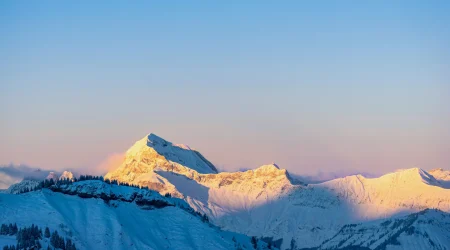 Dusk over the snowy mountains in the Alps