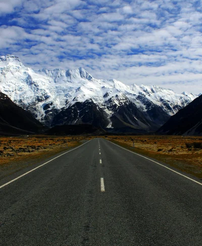 Road with snow capped peaks